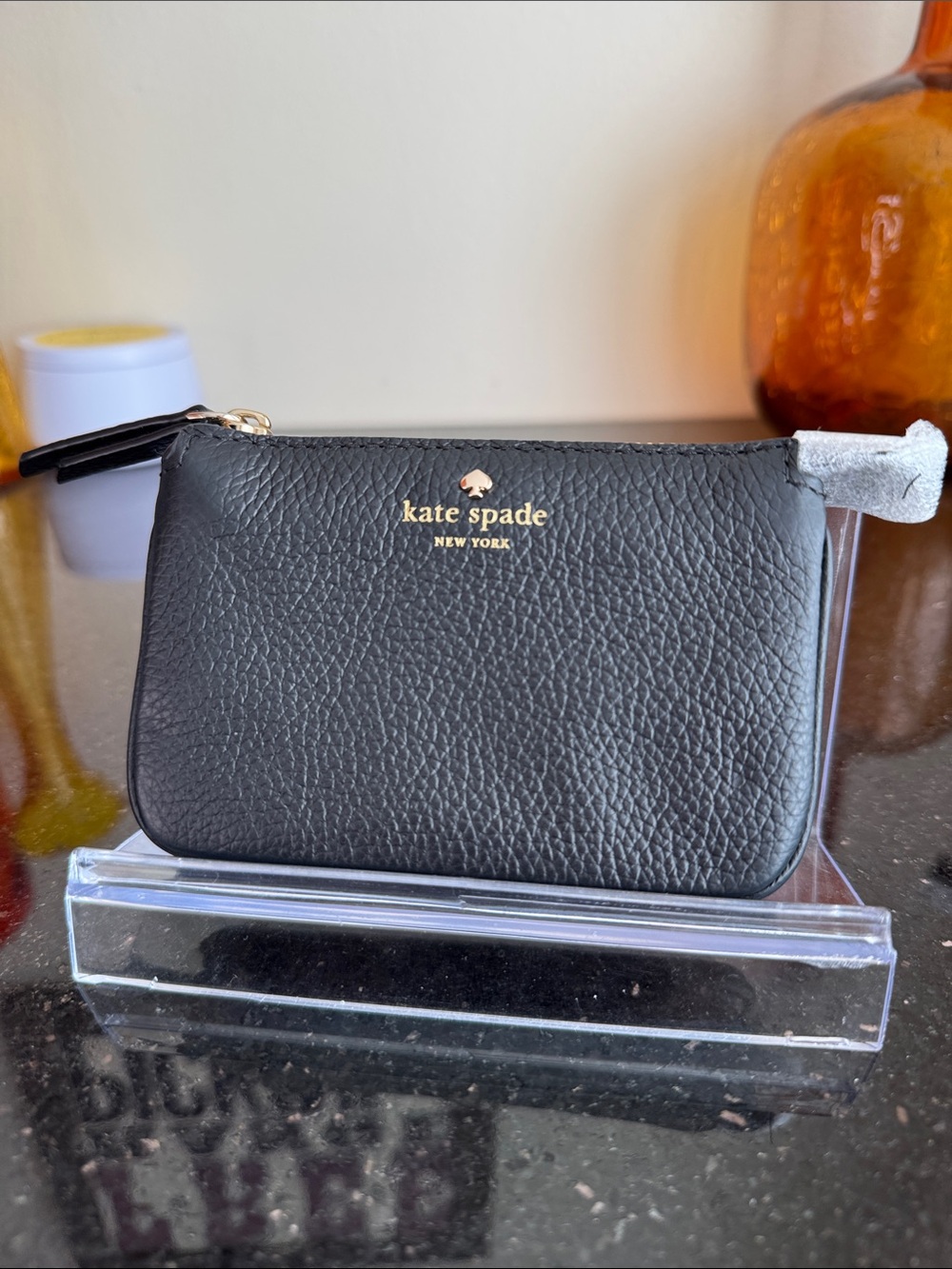 kate spade black pebbled leather coin pouch with gold logo